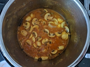 Water added to cook the mushroom biryani
