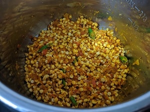Mixing the dal with spices before cooking