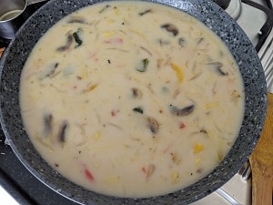 Tom Kha Soup is a spicy, hot and sour soup from the Thai Cuisine. Made with assorted vegetables and mushroom in a flavorful coconut milk broth, this soup is Vegetarian and Vegan.