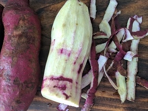 Peeling the sweet potatoes