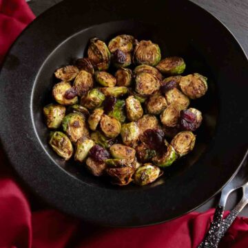 Black Bowl with roasted Brussels sprouts and dried cranberries