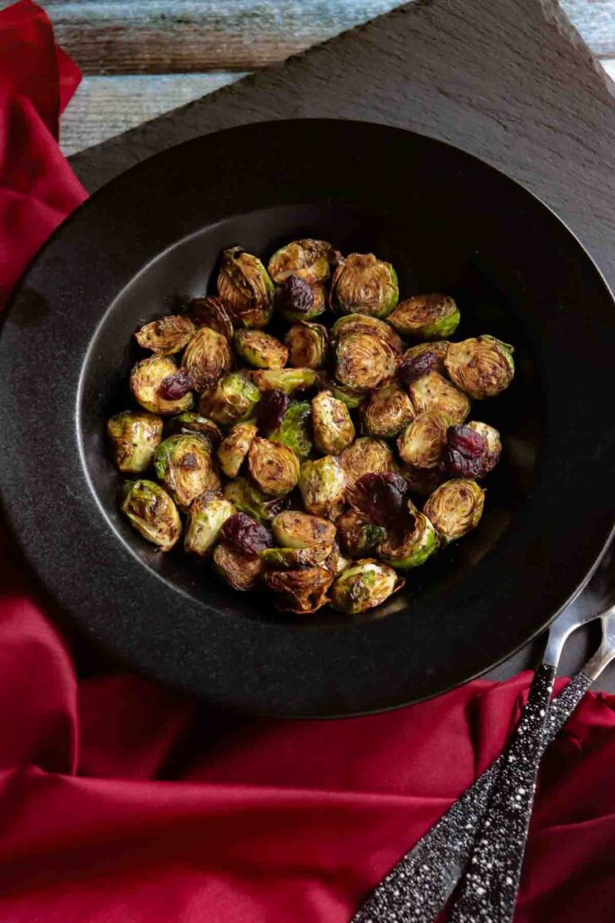 Black Bowl with roasted Brussels sprouts and dried cranberries