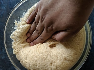 knocking the dough to release air