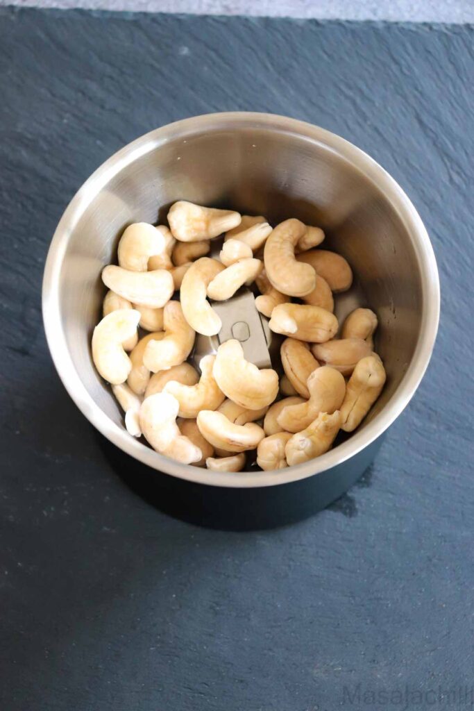 Soaked cashew nuts in a mixer grinder jar