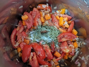 Herbs and Salt added with tomatoes and carrots
