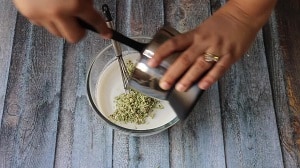 adding the coconut, cumin, chilli mix with yogurt