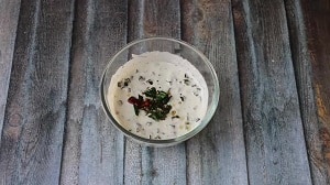 Adding the tempering to the yogurt and vendakkai mix