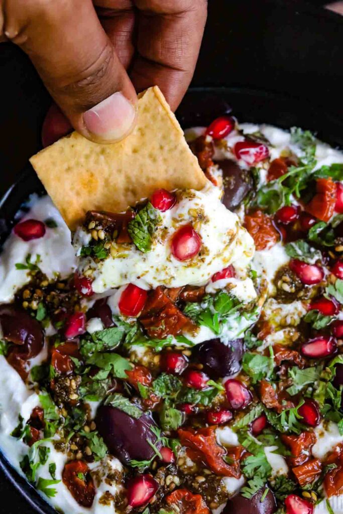Lavash Crackers dipped in labneh