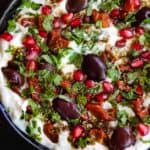 Labneh dip topped with kalamata olives, sun dried tomatoes, herbs and zaatar
