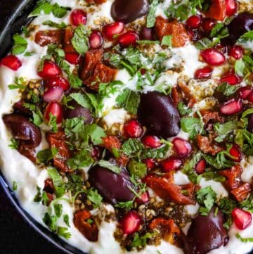 Labneh dip topped with kalamata olives, sun dried tomatoes, herbs and zaatar