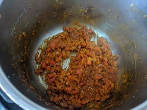 cooking the onion tomato mix