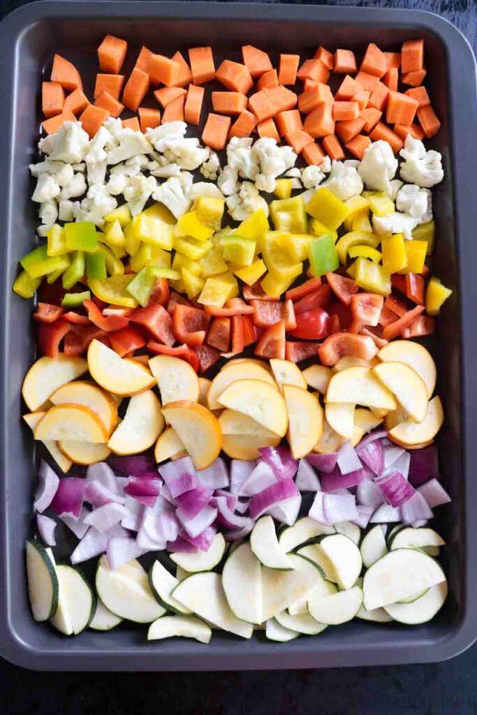 Tray with diced carrots, cauliflower florets, peppers squash, onion and zucchini