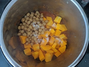 cooked chickpeas, squash added to the onion tomato gravy base