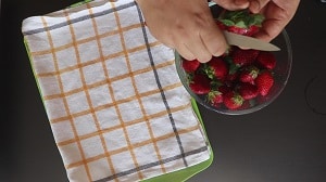 remove the hulls from strawberry using a paring knife