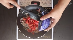 adding finely chopped tomatoes