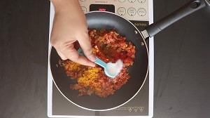 seasoning the gravy base with salt