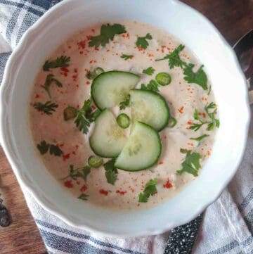 Indian Cucumber Raita Sauce garnished with coriander, green chilies