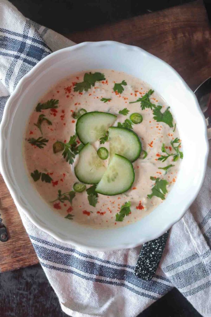 Indian Cucumber Raita Sauce garnished with coriander, green chilies