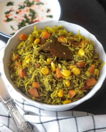 One pot Indian inspired Spinach Rice served with raita